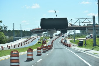 Looking east at construction on Overpass Road and the flyover bridge onto southbound I-75 (8/15/2022 photo)