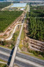 Looking east at Overpass Road over I-75. To the left, clearing is taking place for the realignment of McKendree Road to connect to Boyette Road across from the water treatment plant. (December 13, 2020 photo)