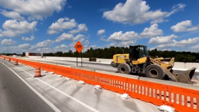 New pavement construction on the north side of SR 56 approaching I-75