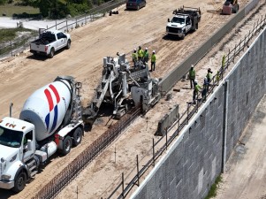 Placing concrete for shoulder barrier wall